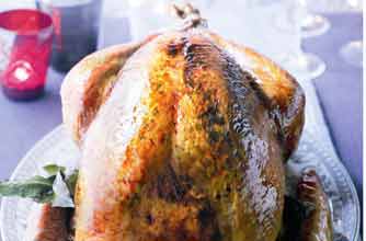 Golden roast turkey with lemon and parsley butter
