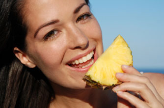 Female eating pineapple