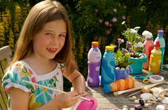 Girl making skittles from plastic bottles