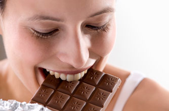 female eating chocolate