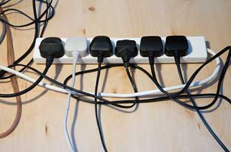 Lots of plugs in an electrical socket Lots of plugs in an electrical socket