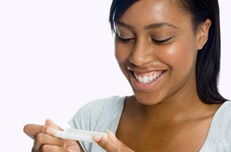 Woman looking at the results of a pregnancy test
