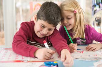 Brother and sister making christmas crafts