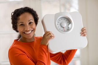 Woman holding scales Woman holding scales
