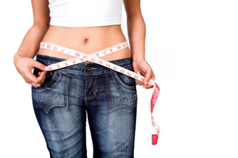 Woman with flat tummy wearing jeans