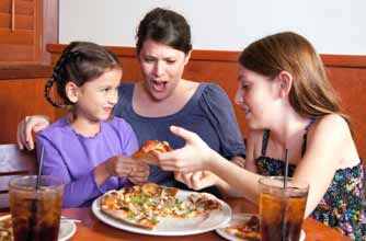 Mum and two daughters in a restaurant