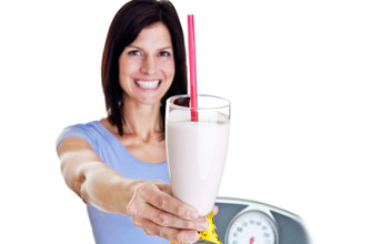Woman holding milkshake