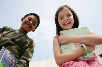 Girl and boy holding school books