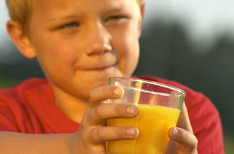 Boy drinking orange juice