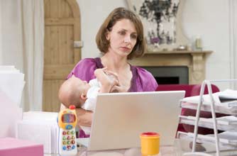Woman with post-natal depression holding her baby