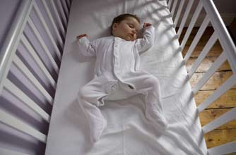 Baby asleep in cot Baby asleep in cot