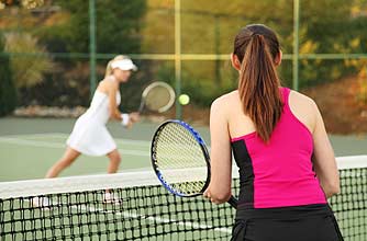 women playing tennis together women playing tennis together