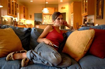 woman on the sofa watching television woman on the sofa watching television