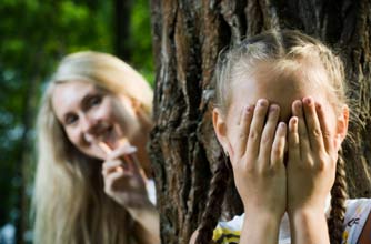 mother and daughter playing hide and seek mother and daughter playing hide and seek