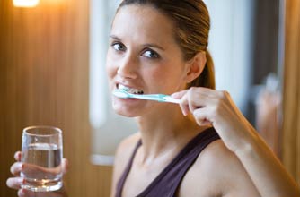 Woman brushing her teeth