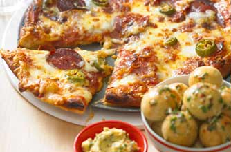 Essentials magazine, spicy salami deep-crust pizza