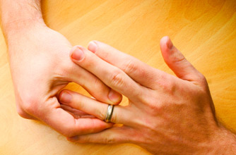 Woman taking off wedding ring