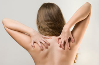 Woman itching her back