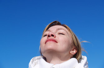 Woman taking a deep breath