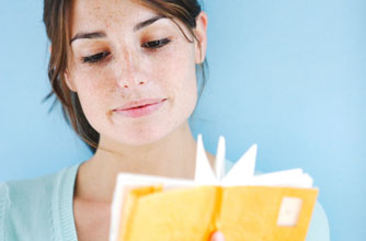 Ovulation - woman checking her diary to see when she ovulates