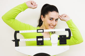 Woman on scales, weightloss