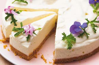 Lemon cheesecake flavoured with geranium leaves and decorated with its flowers Lemon cheesecake flavoured with geranium leaves and decorated with its flowers
