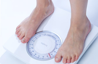 Your cycle explained: Day 12 Woman on scales