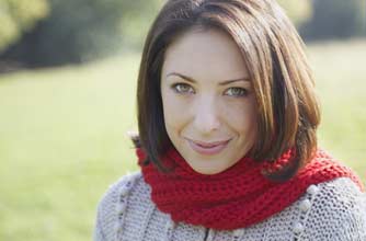 Woman wearing bright coloured scarf Woman wearing bright coloured scarf