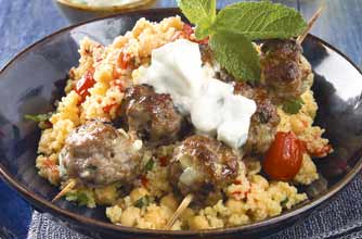 Grilled lamb mince balls in bamboo skewers. This is served with chickpeas, couscous and peppers. For added zing, werve with tzatziki Grilled lamb mince balls in bamboo skewers. This is served with chickpeas, couscous and peppers. For added zing, werve with tzatziki