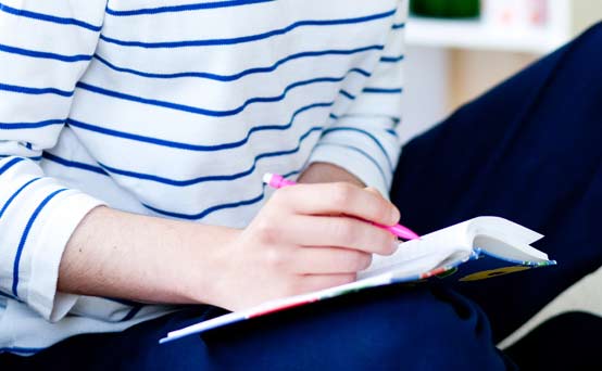 Woman writing a shopping list Woman writing a shopping list