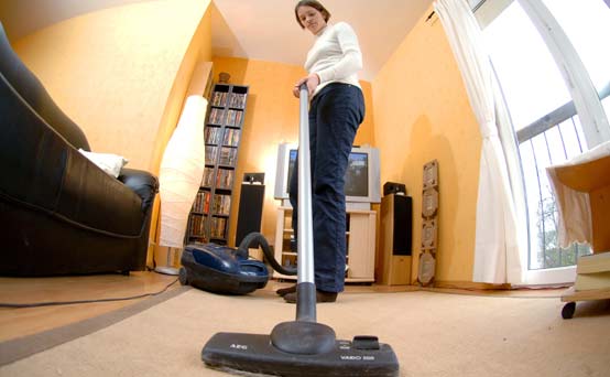 A woman vacuuming A woman vacuuming