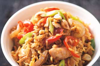 Spicy fried rice with chicken chunks, this is a meal on it's own. It is easy to prepare. Roasted peanuts are added for crunch and flavoured with Thai yellow curry paste and fish sauce.
