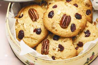 This cookie is crisp and crunchy with bites of pecan nuts and sweet cranberries. It is easy and quick to make. 