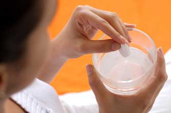 Woman taking aspirin