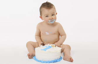 1 year old boy with a birthday cake