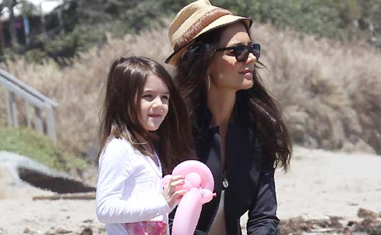 Suri Cruise on the beach with mum Katie Holmes