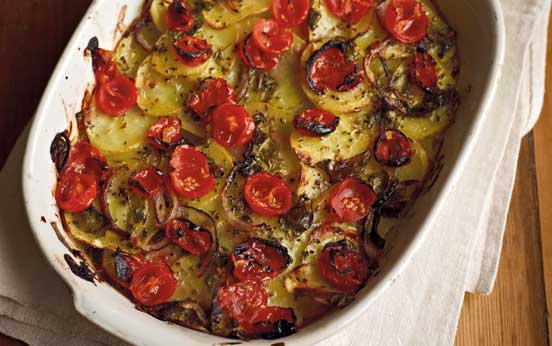 Roasted potatoes with tomato, oregano and basil