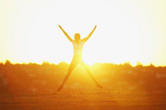 Woman jumping in the sun