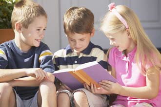 Kids reading a book Kids reading a book