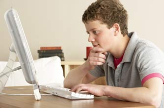 Teenage boy on the computer Teenage boy on the computer