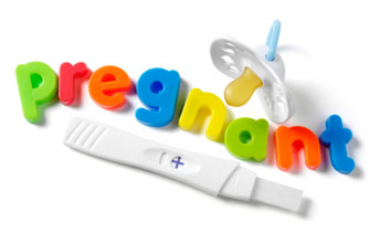Magnetic letters spelling out pregnant Magnetic letters spelling out pregnant
