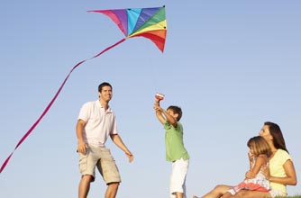 Family flying a kite Family flying a kite