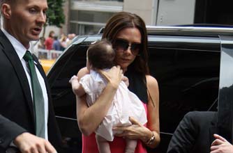 Posh holding Harper Beckham Posh holding Harper Beckham
