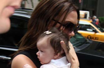 Posh holding Harper Posh holding Harper