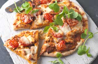 A quick and easy pizza made with ready made piaaz base. It takes only 15 mins to bake.