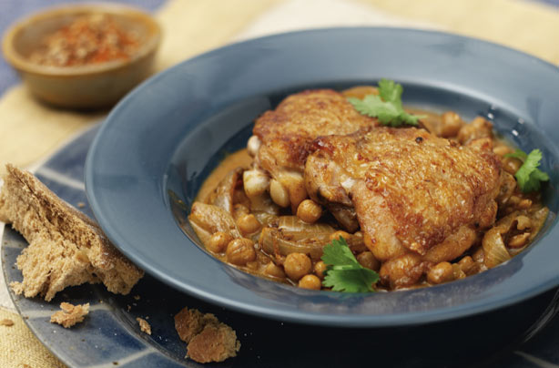 A mildly spiced chicken simmered with chickpeas. This is very tasty for the whole family. Although it takes a bit of effort in cooking, it is worth the work.