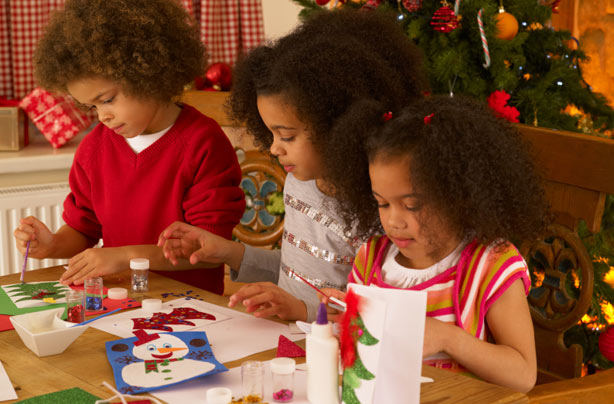 Kids making Christmas crafts and Christmas cards