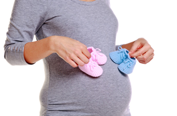 Pregnant woman wondering if she's having a boy or girl Pregnant woman wondering if she's having a boy or girl