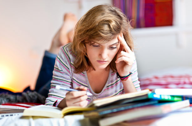 Teenage girl revising for GCSEs