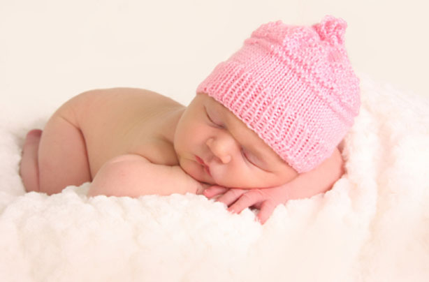 Newborn baby with a pink hat on Newborn baby with a pink hat on